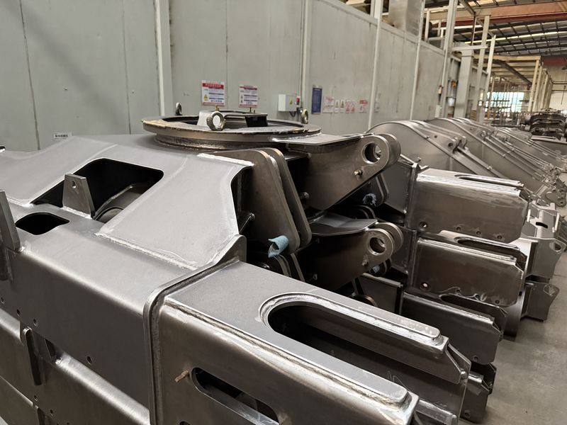 Welded structural assemblies and mounting brackets for excavator frames