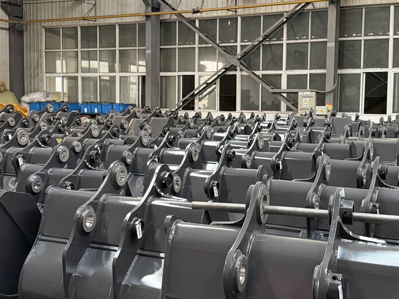 Finished buckets and welded assemblies lined up in the plant